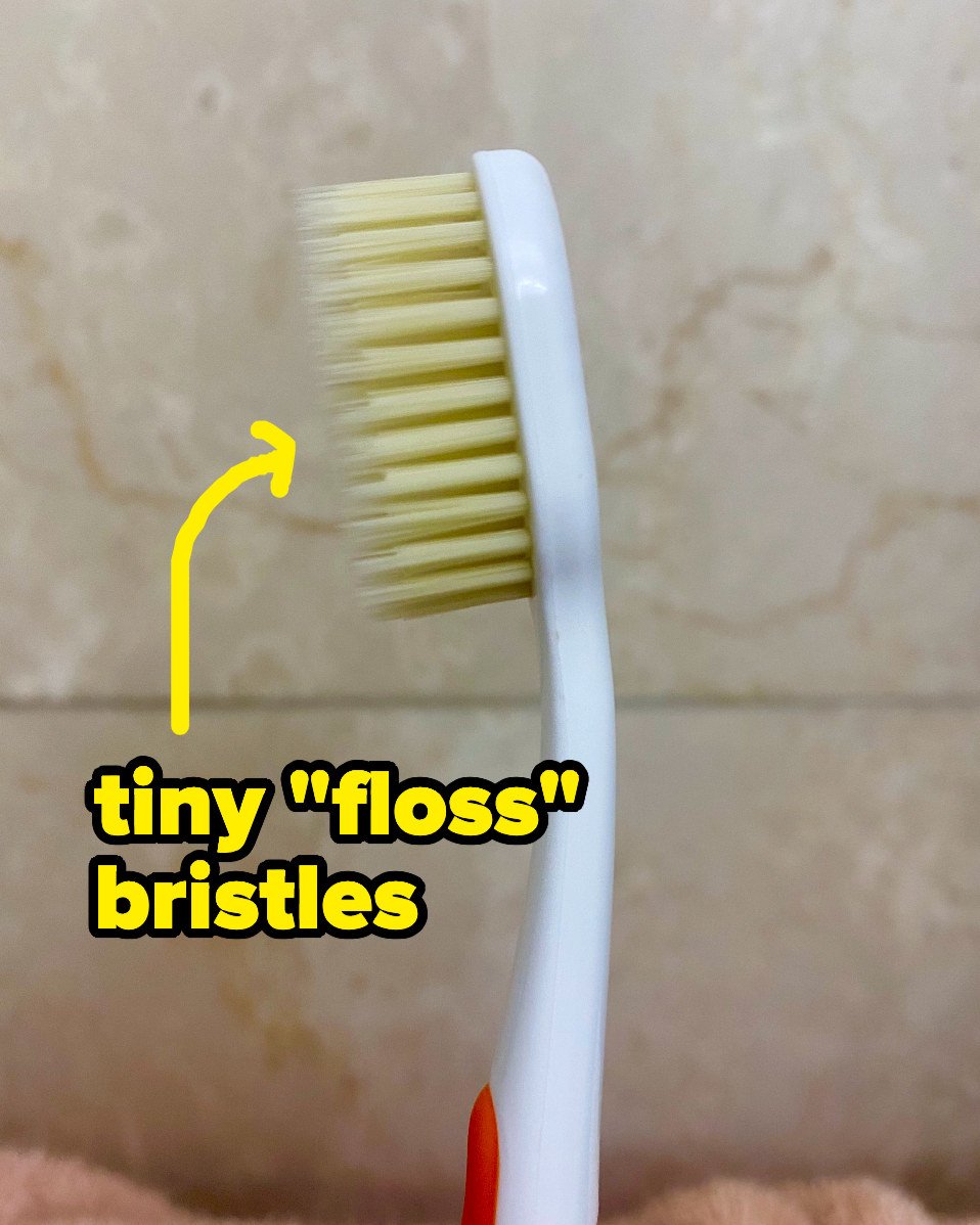 A toothbrush with two layers of bristles, one long and thin and one shorter and thicker 
