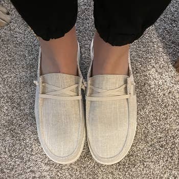 a reviewer wearing the shoes in tan 