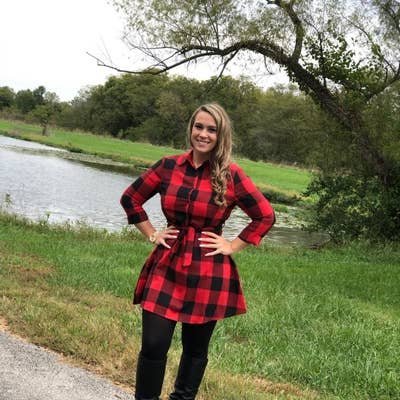 reviewer wearing a red plaid shirt dress