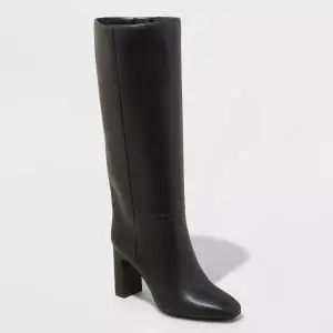 A knee-high black boot with a block heel, showcased against a plain background, suitable for a fashion or shopping context